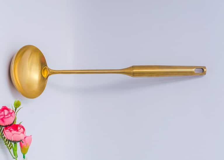 Gold ladle cooking spoon