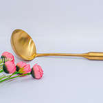 Gold ladle cooking spoon