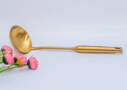 Gold ladle cooking spoon