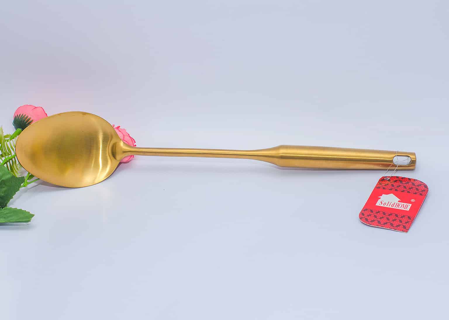 Gold cooking spoon