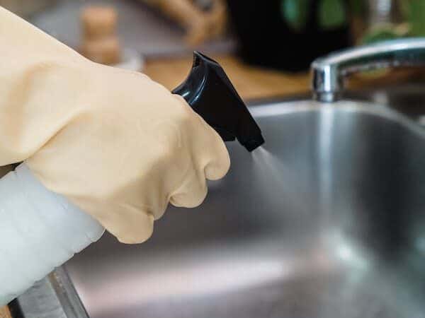 deep cleaning your kitchen - Clear out dirty dishes and clean the sink