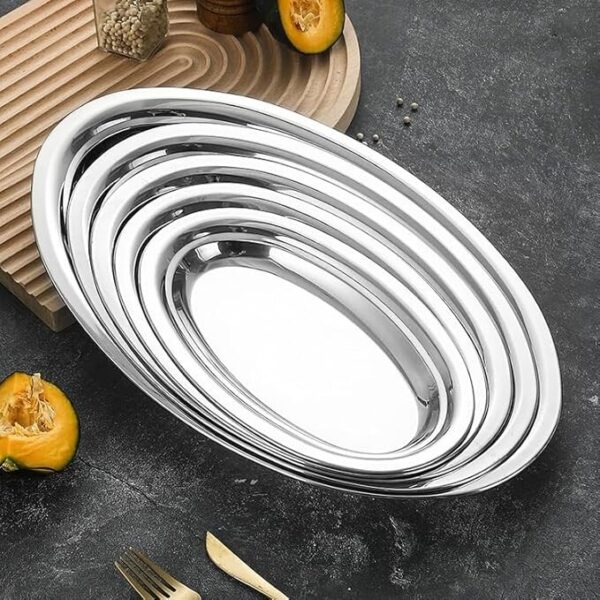 Oval stainless steel food service tray of different sizes