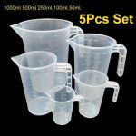 White plastic measuring cup of different sizes 2